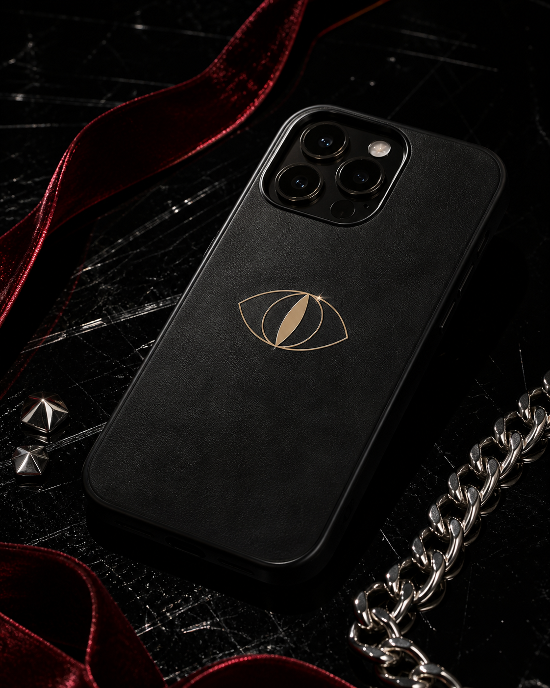 IRVA black phone case styled with crimson ribbon and silver chain